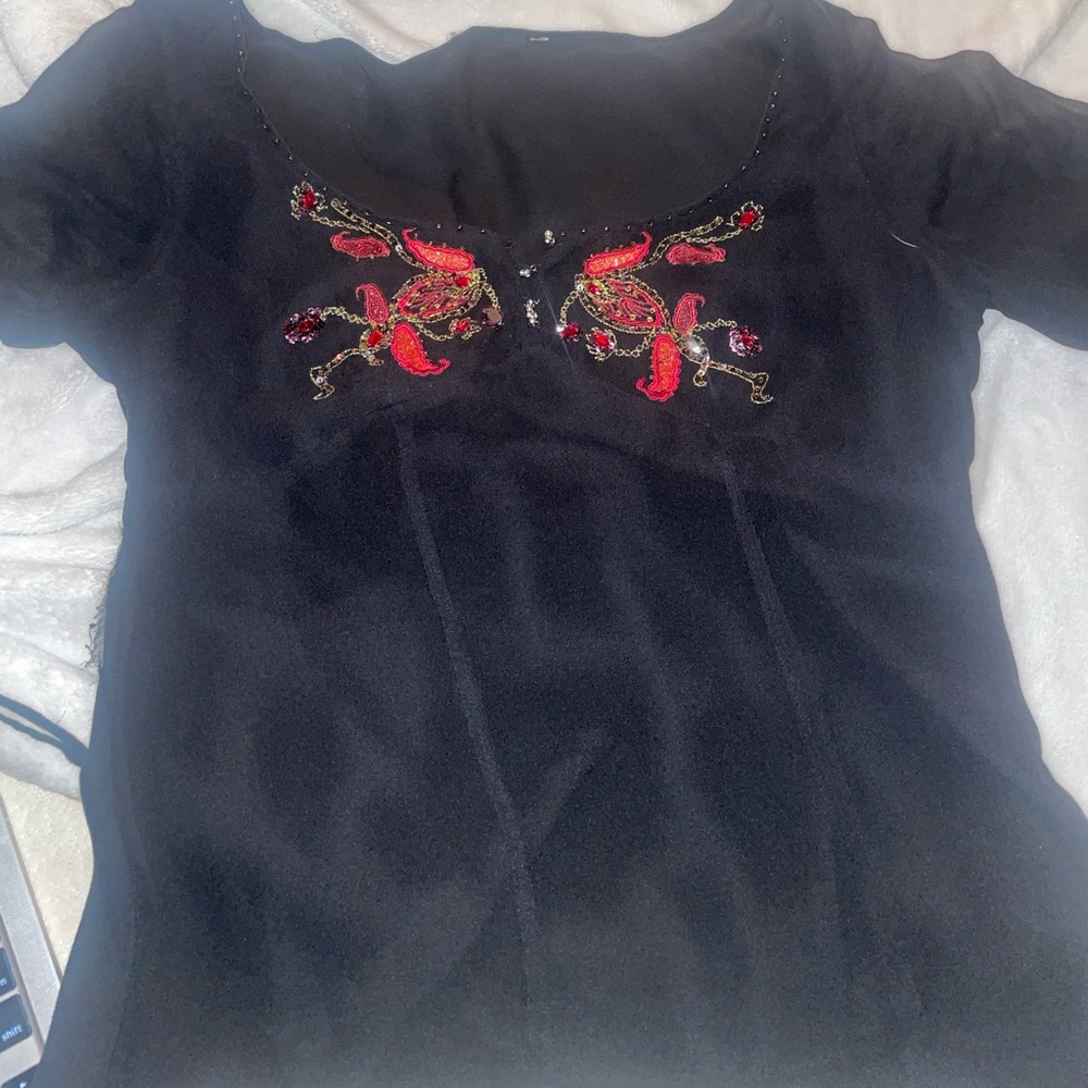 Black mesh blouse with beading.